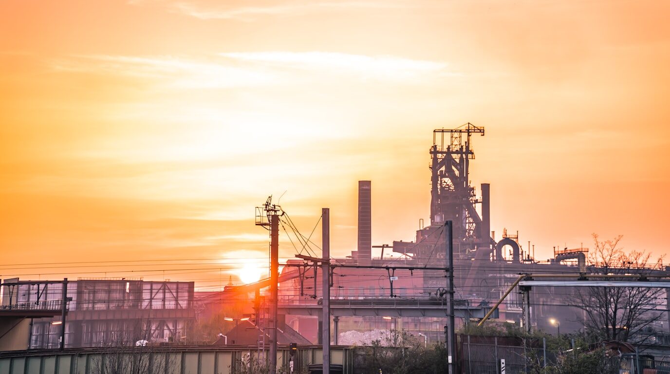A wide view of an industrial facility at golden hour.
